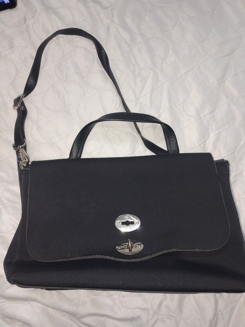 Zanellato Postina bag (Category: Luxury Bags & Wallets) located in Baguio. Submitted by is.titik_lux (Listing ID 1451937025, Image 1). Description: Brand: Zanellato Model: Postina (Tokyo Rimboccata style) Material: Nylon body with leather handle and trim Color: Black Features: Single top handle, detachable/adjustable shoulder strap, flap top with double turn-lock silver hardware closures..