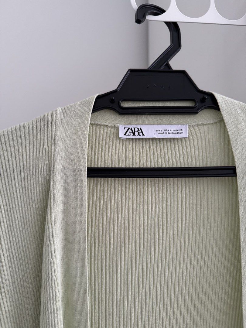 ZARA Ribbed Longline Cardigan Pale Green Size S (Category: Coats, Jackets and Outerwear) located in Kuala Lumpur. Submitted by wildcrystal.b25c71 (Listing ID 1451906322, Image 2). Description: - ZARA pale green longline cardigan - Ribbed knit material - Open front, no buttons - Long sleeves - Hits below the knee - Ideal for layering over any outfit - Comfortable and stylish.