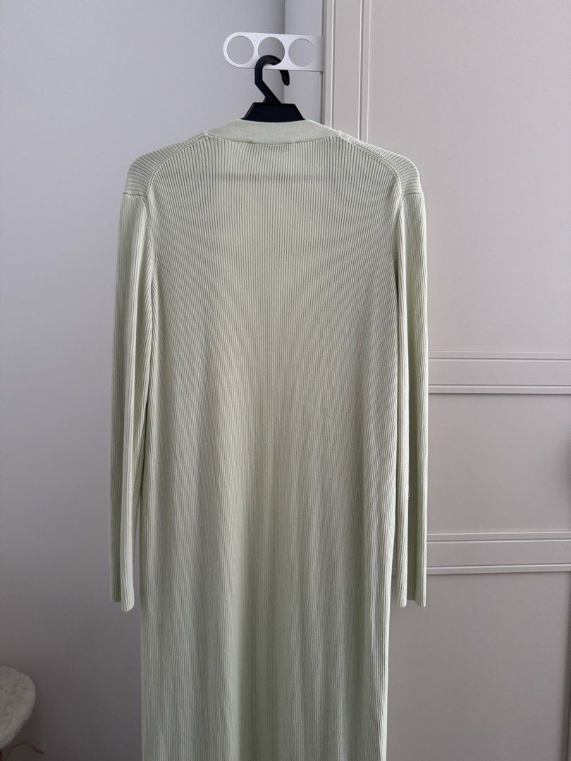ZARA Ribbed Longline Cardigan Pale Green Size S (Category: Coats, Jackets and Outerwear) located in Kuala Lumpur. Submitted by wildcrystal.b25c71 (Listing ID 1451906322, Image 3). Description: - ZARA pale green longline cardigan - Ribbed knit material - Open front, no buttons - Long sleeves - Hits below the knee - Ideal for layering over any outfit - Comfortable and stylish.