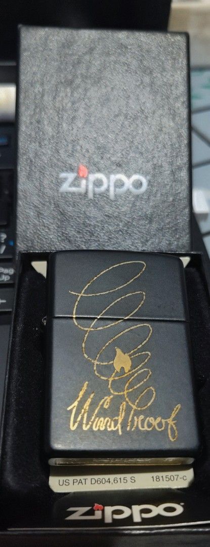 SWAP/SALE Zippo Windproof Butane Lighter - AUTHENTIC (Category: Hiking & Camping) located in Manila. Submitted by karuselkoh (Listing ID 1451927199, Image 1). Description: - Zippo butane lighter - Classic black finish with gold 'Windproof' design - Back features text about Zippo flame history - Made in USA - Includes original box AUTHENTIC 100% OFFER LANG KUNG SWAP.