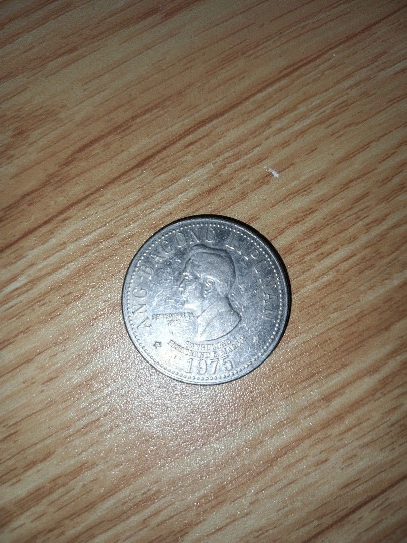 1975 Philippines 5 Piso Coin ft. Ferdinand E. Marcos (Category: Currency) located in Naga. Submitted by esteemed_shop (Listing ID 1452198928, Image 1). Description: - 1975 Philippine 5 Peso coin - Features Ferdinand E. Marcos profile - Reverse side displays the Philippine coat of arms - Ideal addition for coin collectors.