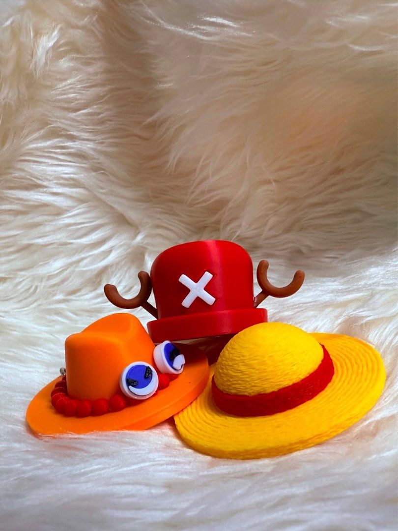 3D Printed One Piece Character Hats Keychain (Category: Character Goods) located in Manila. Submitted by af3dworks (Listing ID 1452234992, Image 1). Description: Ace Hat - 100 pesos Chopper Hat - 90 pesos Luffy Hat - 65 pesos - Ideal for collectors and dedicated fans of the One Piece anime and manga - Small yet highly detailed, perfect for bag and wallet keychain or desk/shelf display.