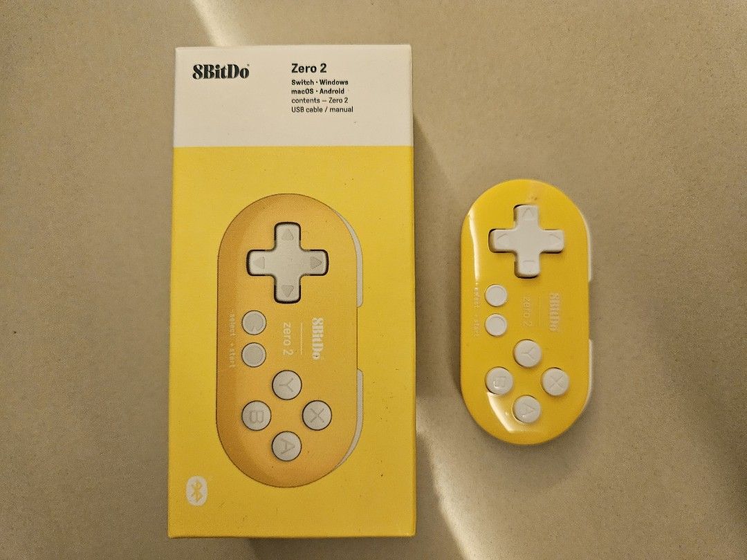 8BitDo Zero 2 Controller Yellow (Category: Controllers) located in Kuala Lumpur. Submitted by deschoong (Listing ID 1452304209, Image 1). Description: - 8BitDo Zero 2 Controller (Yellow) - Compatible with: Nintendo Switch, Windows, macOS, Android - Includes: Controller, USB cable, lanyard, User Manual - Ideal for gaming across multiple devices.