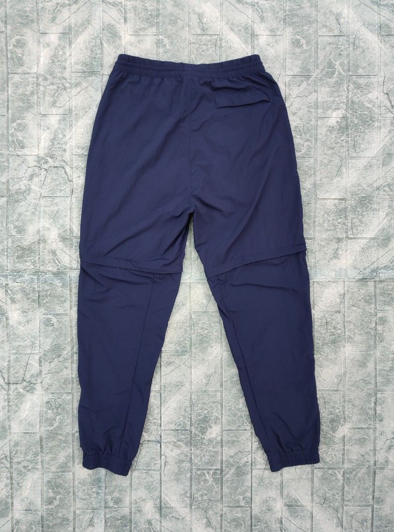 Adidas ADV Convertible Pants - Navy Blue (Category: Joggers) located in Bayambang. Submitted by mon10192816 (Listing ID 1452223404, Image 3). Description: - Waist 30-35 - Length 41 - Issue Loose Stitch check last photo - Adidas ADV convertible pants - Color: Navy blue - Zips off to convert into shorts - Features graphic details on the sides - Elastic waistband with adjustable drawstring - pockets on the back - Ideal for hiking and outdoor activit