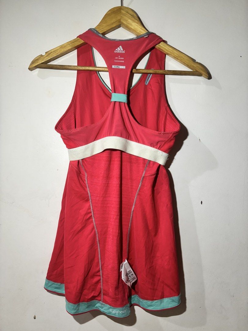 Adidas ClimaLite Running Tank Top (Category: Activewear) located in Kalibo. Submitted by mack29 (Listing ID 1452220621, Image 3). Description: - Red Adidas running tank top - Size: Medium (M) - ClimaLite technology for enhanced breathability - Racerback design with light blue accents - Built-in bra band for added support - Ideal for workouts, running, or casual wear.