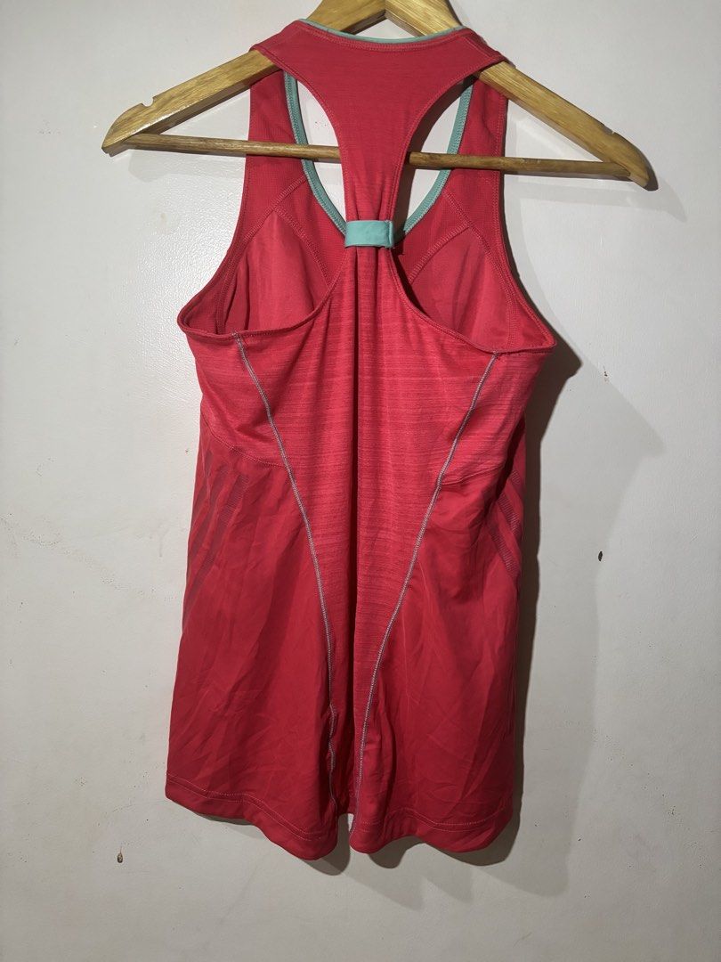 Adidas ClimaLite Running Tank Top (Category: Activewear) located in Kalibo. Submitted by mack29 (Listing ID 1452220621, Image 2). Description: - Red Adidas running tank top - Size: Medium (M) - ClimaLite technology for enhanced breathability - Racerback design with light blue accents - Built-in bra band for added support - Ideal for workouts, running, or casual wear.