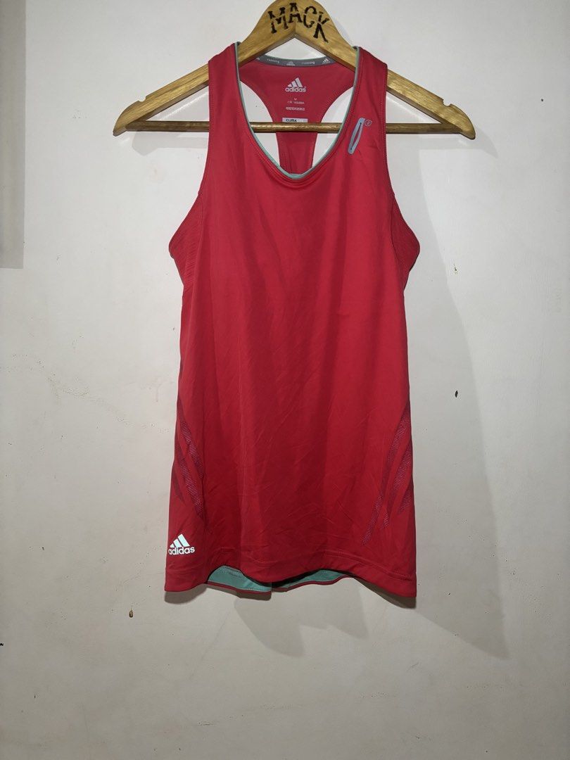 Adidas ClimaLite Running Tank Top (Category: Activewear) located in Kalibo. Submitted by mack29 (Listing ID 1452220621, Image 1). Description: - Red Adidas running tank top - Size: Medium (M) - ClimaLite technology for enhanced breathability - Racerback design with light blue accents - Built-in bra band for added support - Ideal for workouts, running, or casual wear.