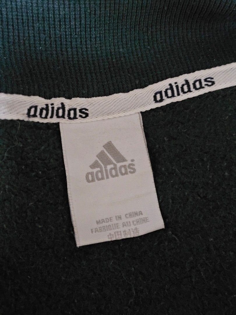 Adidas Green Jacket (Category: Coats, Jackets and Outerwear) located in Quezon City. Submitted by kyeoptaaa (Listing ID 1452213019, Image 2). Description: Green Adidas jacket with snap buttons, ribbed cuffs/hem. Missing buttons, but still wearable. Colors may differ slightly due to lighting.