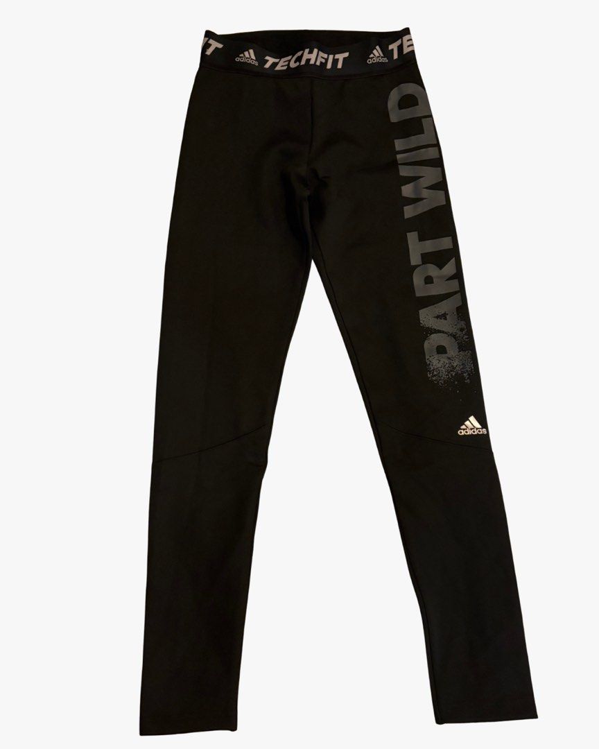 Adidas Techfit "Part Wild" Leggings (Category: Activewear) located in Taguig. Submitted by umiscart (Listing ID 1452136386, Image 2). Description: - Black Adidas Techfit leggings - Features "Part Wild" graphic on the side - Ideal for workouts or casual wear - Comfortable and stretchy material - Adidas logo on waistband and leg Never been used but no tags.