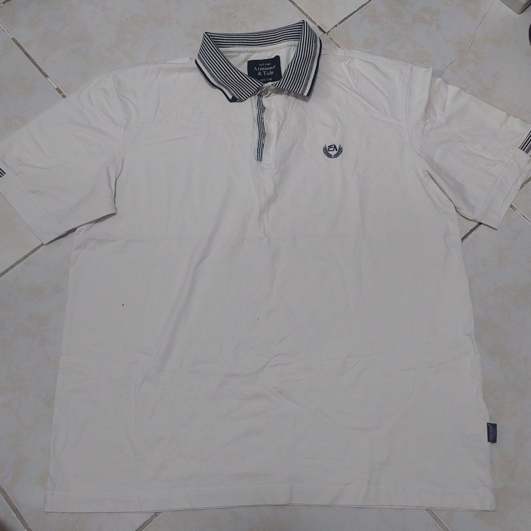 AIMANSEI & TIDE 3XL White Polo Shirt (Category: Tshirts & Polo Shirts ) located in Quezon City. Submitted by _ysxh (Listing ID 1452140258, Image 2). Description: - Brand: AIMANSEI & TIDE - Color: White - Size: 3XL - Measurements: Width 57.5 cm, Length 69.5 cm - Features: Classic collar with striped detail, small embroidered chest logo, striped sleeve cuffs - Style: Casual wear - Shipping to be shouldered by buyer (Item is located in Quezon City) 