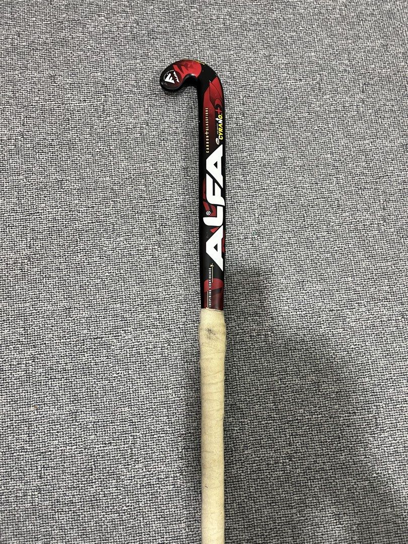 ALFA CYRANO+ Carbon Glassfibre Hockey Stick (Category: Other Sports Equipment and Supplies) located in Kuala Lumpur. Submitted by rayyanis (Listing ID 1452232097, Image 2). Description: - ALFA CYRANO+ hockey stick - Made with carbon and glassfibre - Stylish black and red design - Features grip tape for enhanced control - Perfect for playing hockey - Ready to hit the field! COD AREA IPOH bole nego.