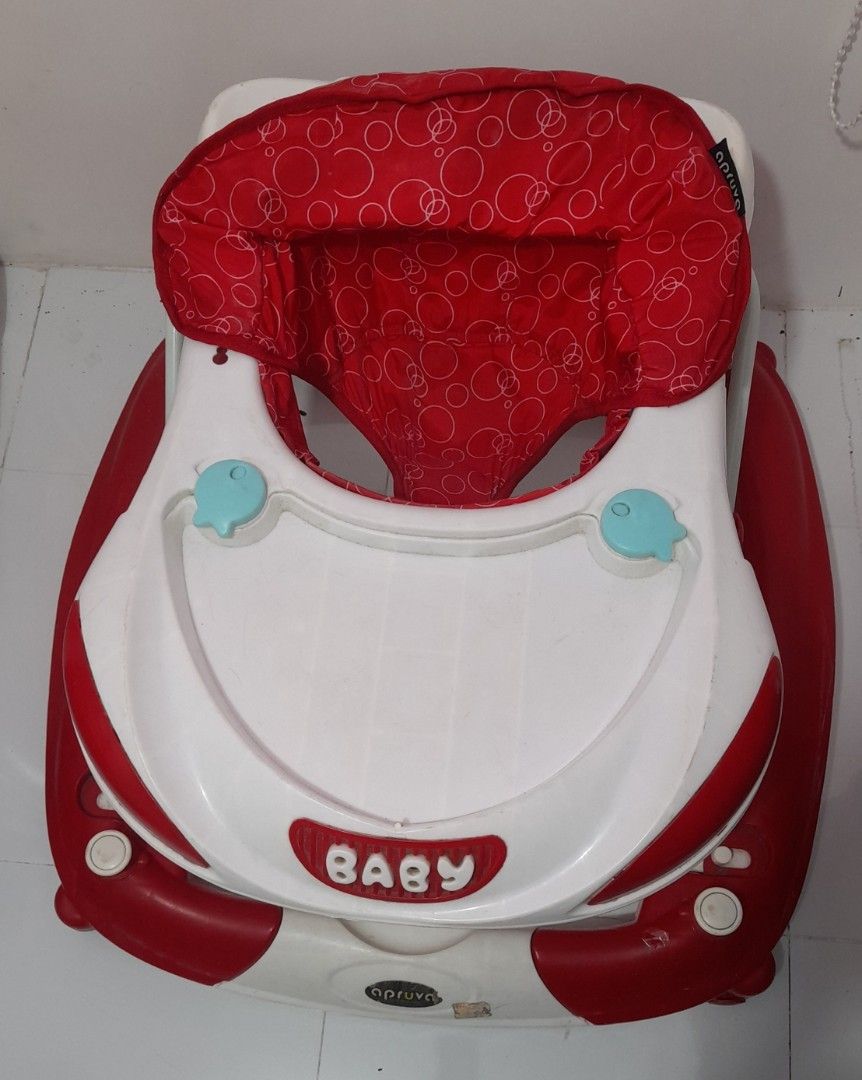 Apruva Baby Walker Red and White (Category: Infant Playtime) located in Quezon City. Submitted by beautyonlinecollectionkcm (Listing ID 1452118116, Image 1). Description: - Red and white baby walker - Padded seat with fun circle pattern - Tray with two light blue toy holders - Sturdy red base with white accents - Ready for a new little explorer!.