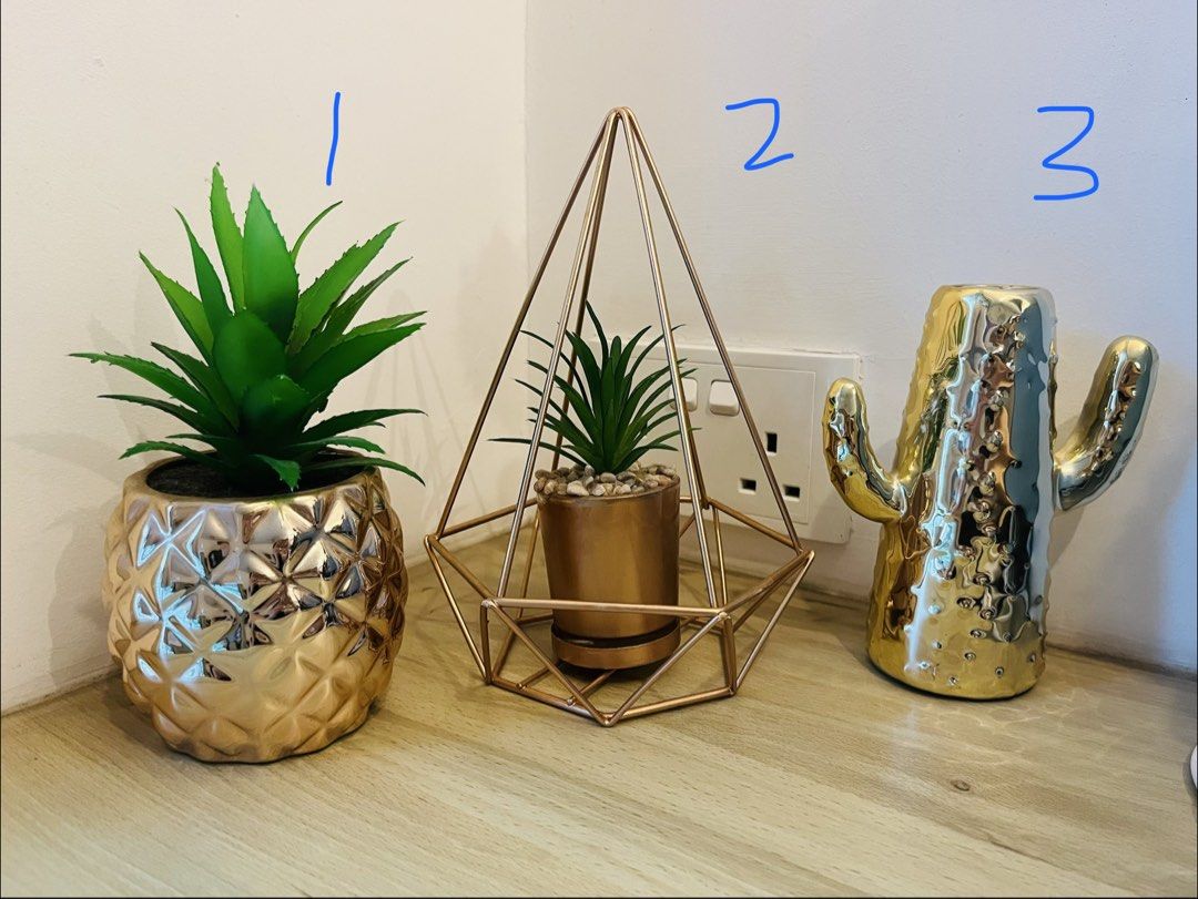 Assorted home decor items (Category: Home Improvement Tools & Accessories) located in Singapore. Submitted by littlemisspixie (Listing ID 1452213421, Image 1). Description: MOVE OUT SALE- self collect or Carousell delivery by 4 Aug All at $1 each 14 items on sale in total #1-11- artificial plants/ flowers (some from Primark) #12-13- door decor/ sign #14- ikea Vinter 2018 plant hanger .