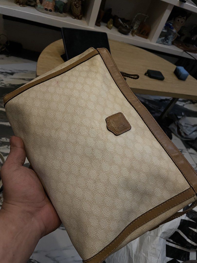 Authentic Celine Monogram Pouch Clutch Bag (Category: Luxury Bags & Wallets) located in Cavite. Submitted by ohmie23 (Listing ID 1452295968, Image 1). Description: - Vintage Celine pouch - Classic monogram print - Brown leather trim - Zipper closure - Interior small zipped pocket - Ideal for collectors or everyday use.