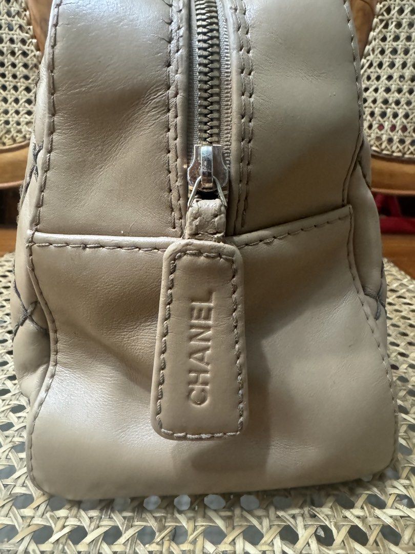 [AUTHENTIC] CHANEL WILD STITCH BOWLER BAG (Category: Luxury Bags & Wallets) located in Santa Rosa. Submitted by rjaarmblo (Listing ID 1452319835, Image 3). Description: - Beige Chanel handbag - Classic diamond quilting - Prominent black CC logo on the front - Secure zipper closure with branded tag - Comfortable leather handles - Ideal for everyday use - Adds a stylish touch to any outfit -Color enhanced already; but holo intact -As is where is; m