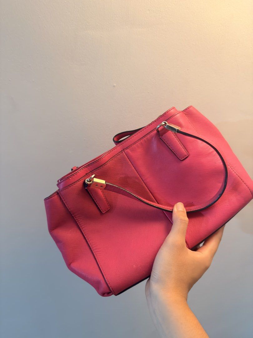 Authentic Coach Pink Leather Hand Bag (Category: Luxury Bags & Wallets) located in Tarlac. Submitted by thisispat (Listing ID 1452246422, Image 3). Description: - Authentic Pink Coach Tote Bag - Genuine Leather Material - Secure Zip Closure - Two Comfortable Top Handles - Spacious Interior with Multiple Compartments - Includes Original Coach Hangtag - Ideal for Everyday Use - With dust stains on the exterior of the bag.