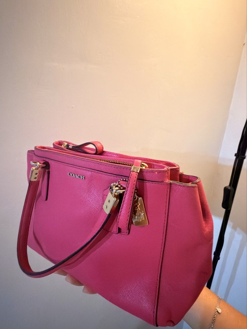 Authentic Coach Pink Leather Hand Bag (Category: Luxury Bags & Wallets) located in Tarlac. Submitted by thisispat (Listing ID 1452246422, Image 2). Description: - Authentic Pink Coach Tote Bag - Genuine Leather Material - Secure Zip Closure - Two Comfortable Top Handles - Spacious Interior with Multiple Compartments - Includes Original Coach Hangtag - Ideal for Everyday Use - With dust stains on the exterior of the bag.