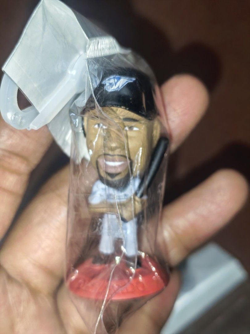 Baseball Player Bobblehead Figurine (Category: Figurines & Statues) located in Paranaque City. Submitted by furugiyafinds (Listing ID 1452174722, Image 1). Description: - Miniature baseball player figurine - Includes a red display base - Still sealed in original plastic packaging - Ideal for collectors or as a small gift - Unique collectible item.