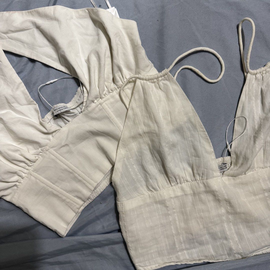 Bershka Tops take 2 for 250 (Category: Sleeveless) located in Aloran. Submitted by kheyx (Listing ID 1452227456, Image 2). Description: - Bershka White Corset Top & Camisole Set - Size: S - Corset Top: Long sleeves, tie-back detail - Camisole: Cropped, thin straps just needs proper washing take both for 250 only.