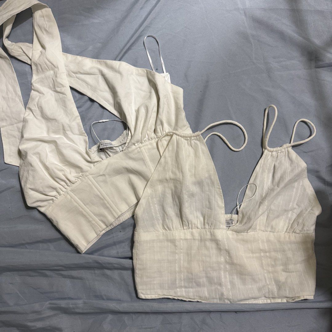 Bershka Tops take 2 for 250 (Category: Sleeveless) located in Aloran. Submitted by kheyx (Listing ID 1452227456, Image 1). Description: - Bershka White Corset Top & Camisole Set - Size: S - Corset Top: Long sleeves, tie-back detail - Camisole: Cropped, thin straps just needs proper washing take both for 250 only.