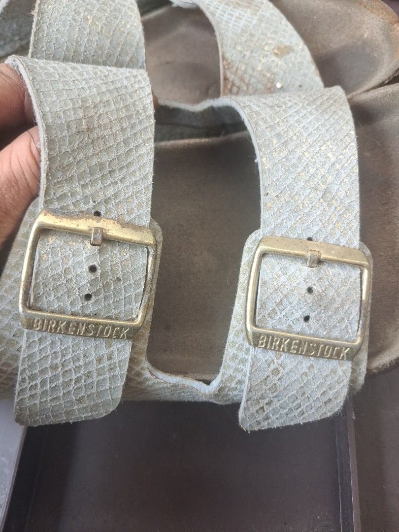 Birkenstock (Category: Slippers & Slides) located in Manila. Submitted by beardedbot (Listing ID 1452143270, Image 3). Description: - Brand: Birkenstock - Size: EU 40 (UK 6 / US 7) -Original - Style: Classic Arizona model - Color: Light grey/silver textured straps - Footbed: Signature cork material - Features: Adjustable straps with buckle closure - Meetup Location: BDO Blumentritt, Manila.