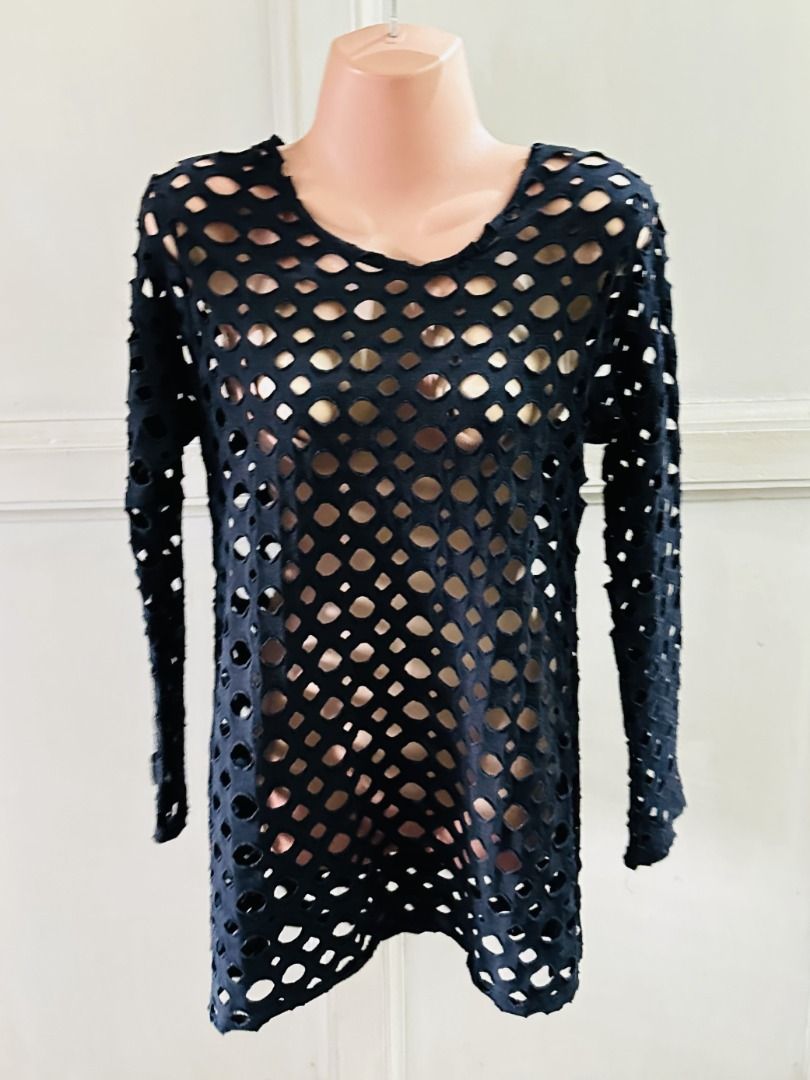 Black Cut-out Long Sleeve Top all-over cut-out pattern (Category: Longsleeves) located in Cebu City. Submitted by annaincebu (Listing ID 1452246103, Image 2). Description: 👕 ✅ MEASUREMENTS: Length: 27 inches Width: 16 inches Sleeves: 22 inches 📦 DELIVERY: Maxim COD (for within Cebu) or LBC or JRS Express (outside Cebu) ✅ NOTES: - Black long-sleeve top - Unique all-over cut-out pattern - Classic V-neckline - Soft fabric - Versatile for layering 
