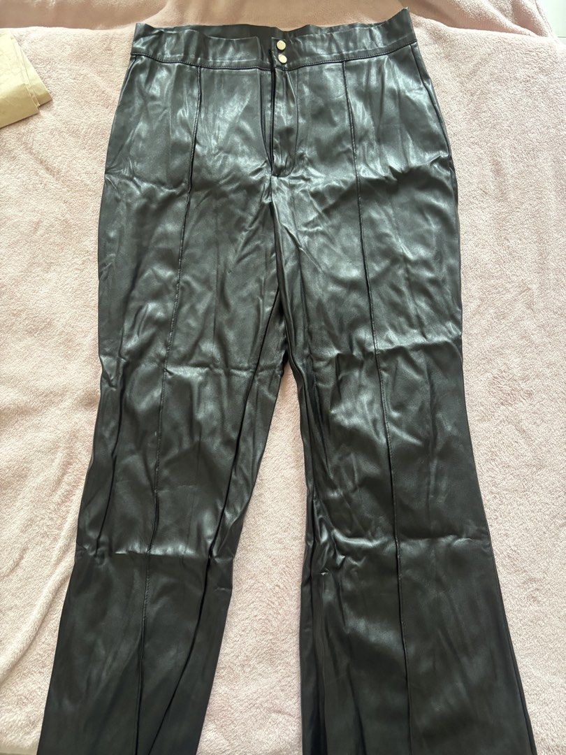 Black Faux Leather Flare Pants (Category: Other Bottoms) located in Tarlac. Submitted by wekewl (Listing ID 1452177262, Image 1). Description: - High-waisted black pants - Faux leather finish - Front seam detail on each leg - Flare at the bottom - Two-button closure at the waist - Perfect for dressing up or down.