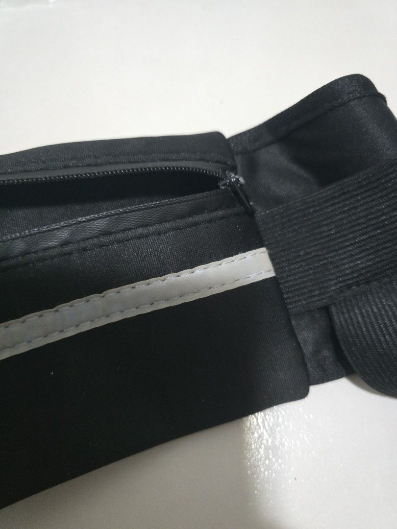 Black Running Waist Bag with Reflective Strip (Category: Belt bags, Clutches and Pouches) located in Pasig City. Submitted by callmemaf (Listing ID 1452184738, Image 3). Description: - FREE FOR ANY PURCHASE ABOVE 250 - Zipper stuck - Black waist bag perfect for running or cycling. - Features a secure zippered compartment for your essentials. - Includes a reflective strip for enhanced visibility during night activities. - Adjustable strap with a b