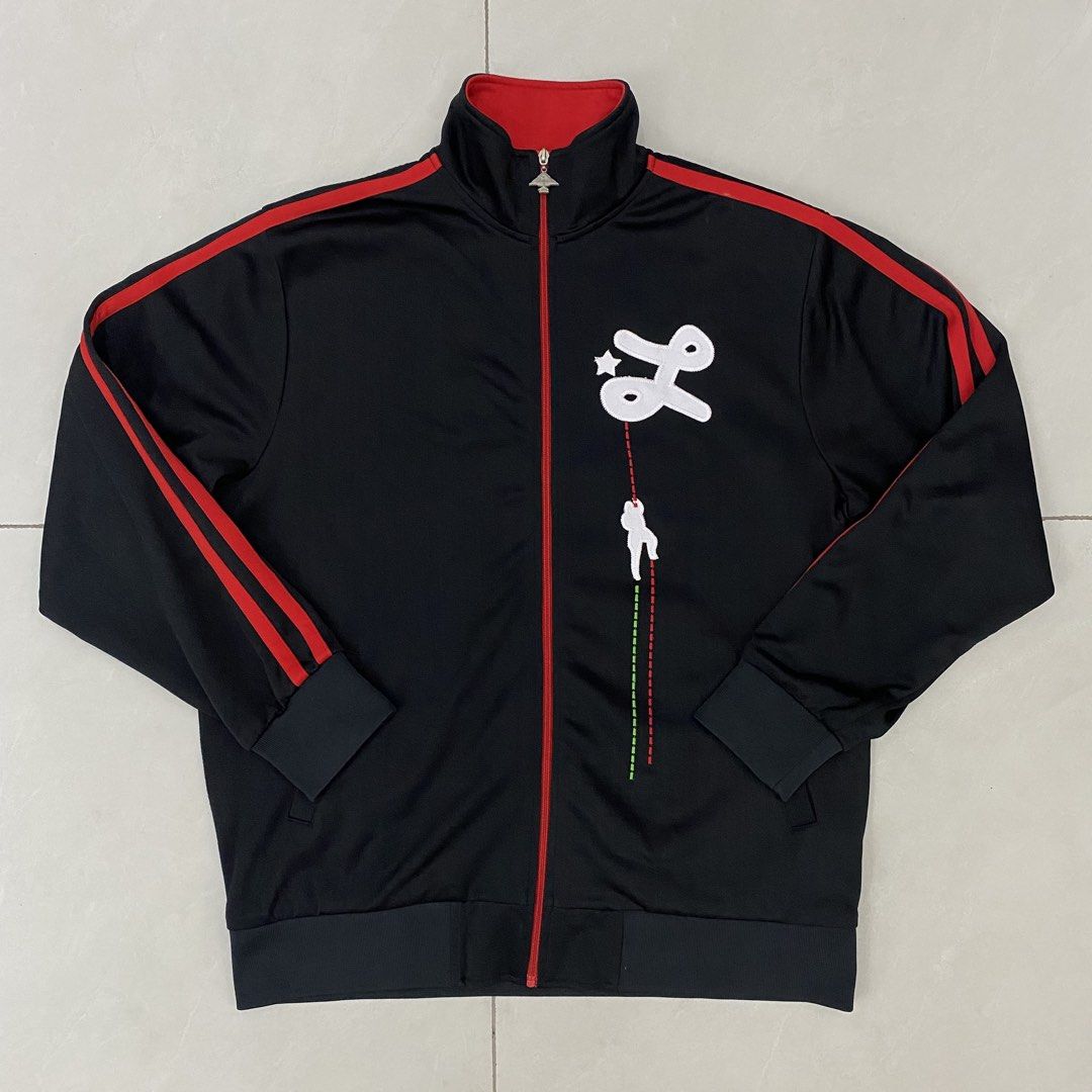 Y2k LRG track jacket (Category: Activewear) located in Cavite. Submitted by mana__ (Listing ID 1452261747, Image 1). Description: - Black track jacket - Red stripe details on sleeves and collar - Unique front graphic (star, stylized 'L', climber) - Zipper pull with tree-like emblem - Ideal for casual wear - XXL Width - 25 Length - 29.5 Shoulders - 19.5 Sleeve - 24.5 Hem - 22 Very good * loose stitch.