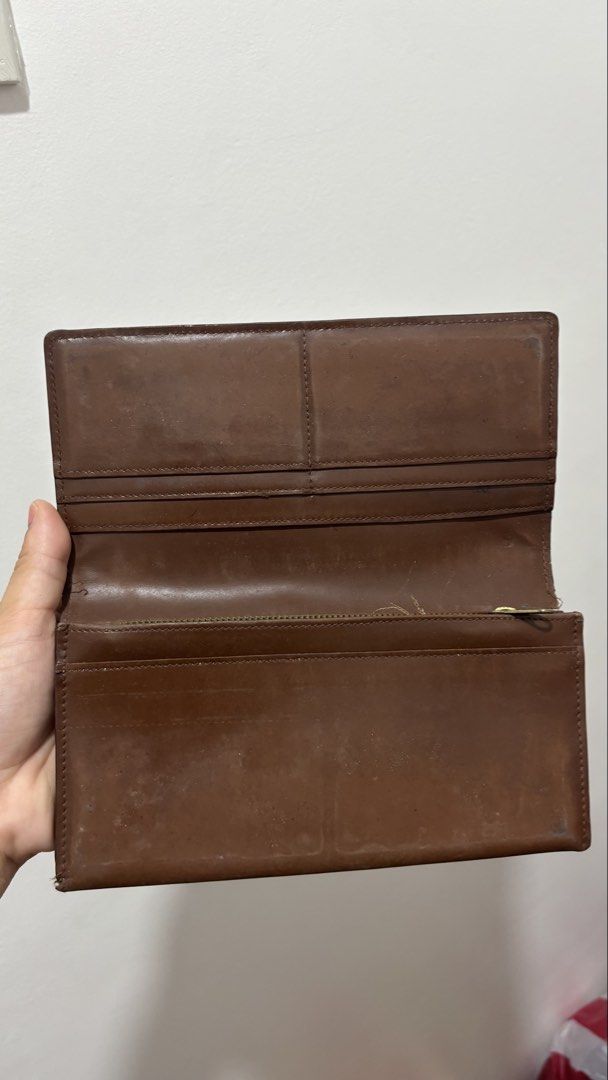 Brown Leather Long Wallet with Zipper (Category: Wallets & Card holders) located in Manila. Submitted by robbyrabbit (Listing ID 1452288725, Image 2). Description: - Brown leather long wallet - Interior zippered compartment - Ample card slots - Clear ID window - Zipper in good working condition - Plenty of life left.