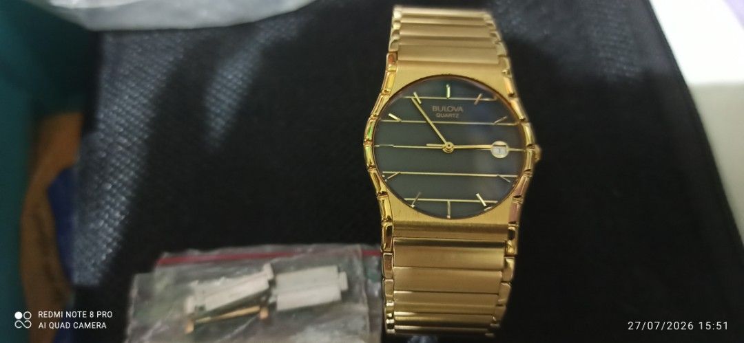 Bulova Quartz Gold Tone Watch with Date (Category: Women's Watches) located in Taguig. Submitted by aet66 (Listing ID 1452185976, Image 1). Description: - Gold tone Bulova watch - Dark dial with gold line markers - Date window - Reliable quartz movement - Versatile for everyday wear or dressing up - unisex watch - price negotiable .