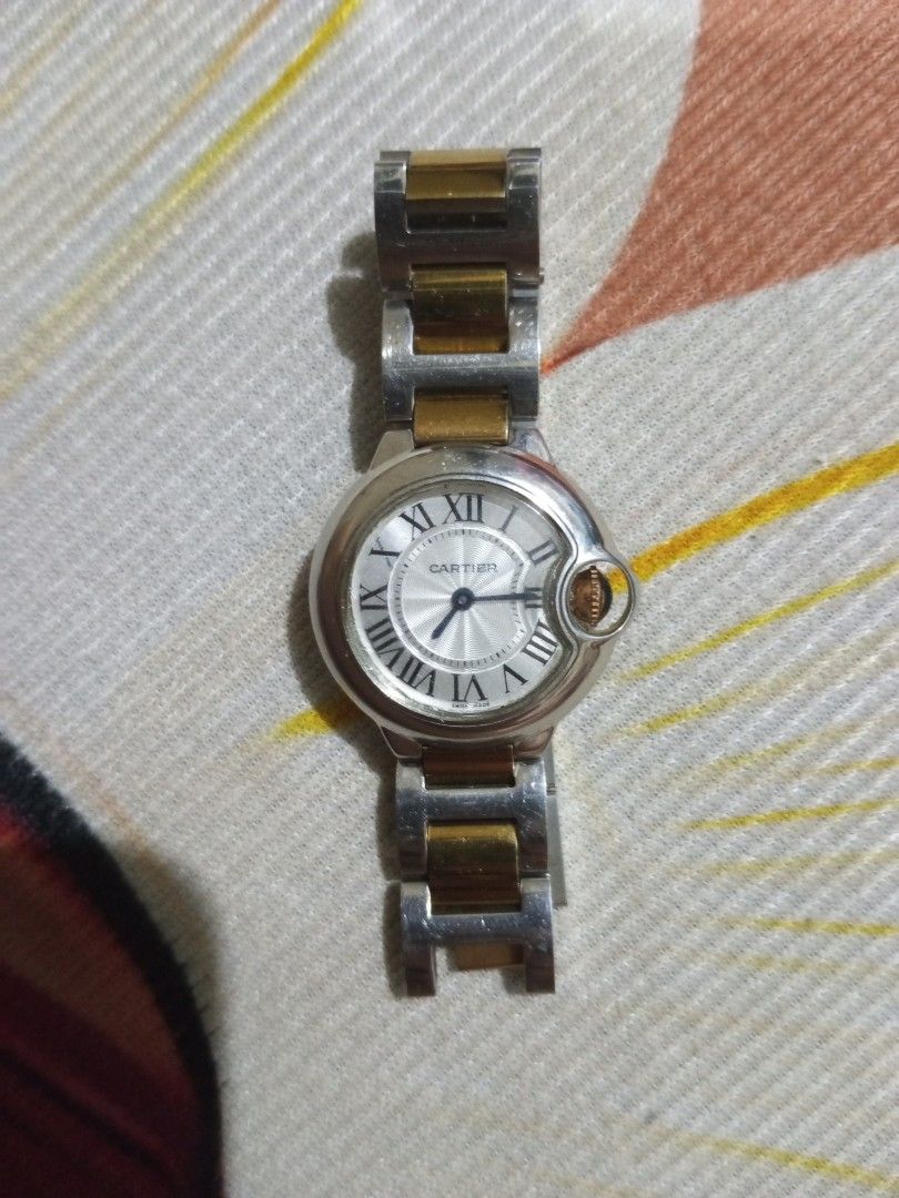 Cartier Ballon Bleu Two-Tone Watch (Category: Luxury Watches) located in Manila. Submitted by _thrifters (Listing ID 1452247379, Image 2). Description: -Cartier Ballon Bleu watch - Elegant silver dial with Roman numerals - Durable two-tone stainless steel bracelet - Swiss made for precision and quality - Iconic crown with signature blue cabochon.