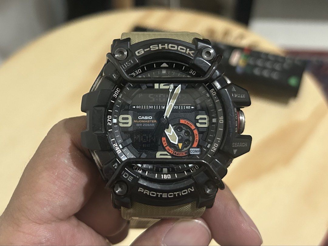 Casio G-Shock Mudmaster GG-1000 Watch (Category: Men's Watches) located in Manila. Submitted by 5635ian81997 (Listing ID 1452202550, Image 2). Description: - Model: Casio G-Shock Mudmaster GG-1000 - Color: Black and Tan - Key Features: Mud Resist, Shock Resist - Water Resistance: Up to 20 Bar (200 meters) - Display: Digital and Analog - Ideal For: Outdoor activities, tough environments - Condition: Good working condition Slightly Negotiable.