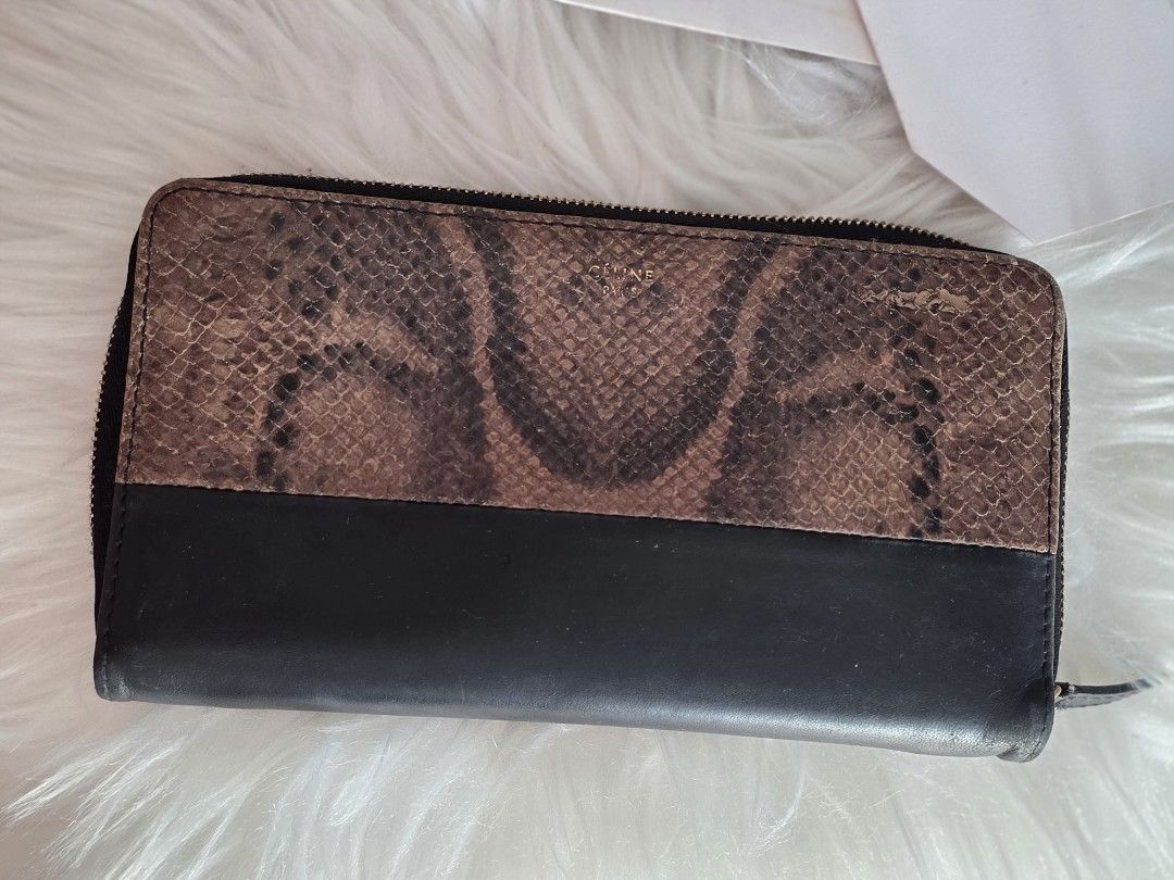 Celine Python Two Tone Wallet (Category: Bags & Wallets) located in Singapore. Submitted by lw.y.y (Listing ID 1452184444, Image 3). Description: Gorgeous Celine Python Pattern Long Wallet with a two-tone design featuring python skin and smooth black leather. lost dustbag, come with cards. Brand: Celine Material: Python skin and calfskin leather Design: Long wallet with a zipper closure and a python skin upper panel bought $1000+!.