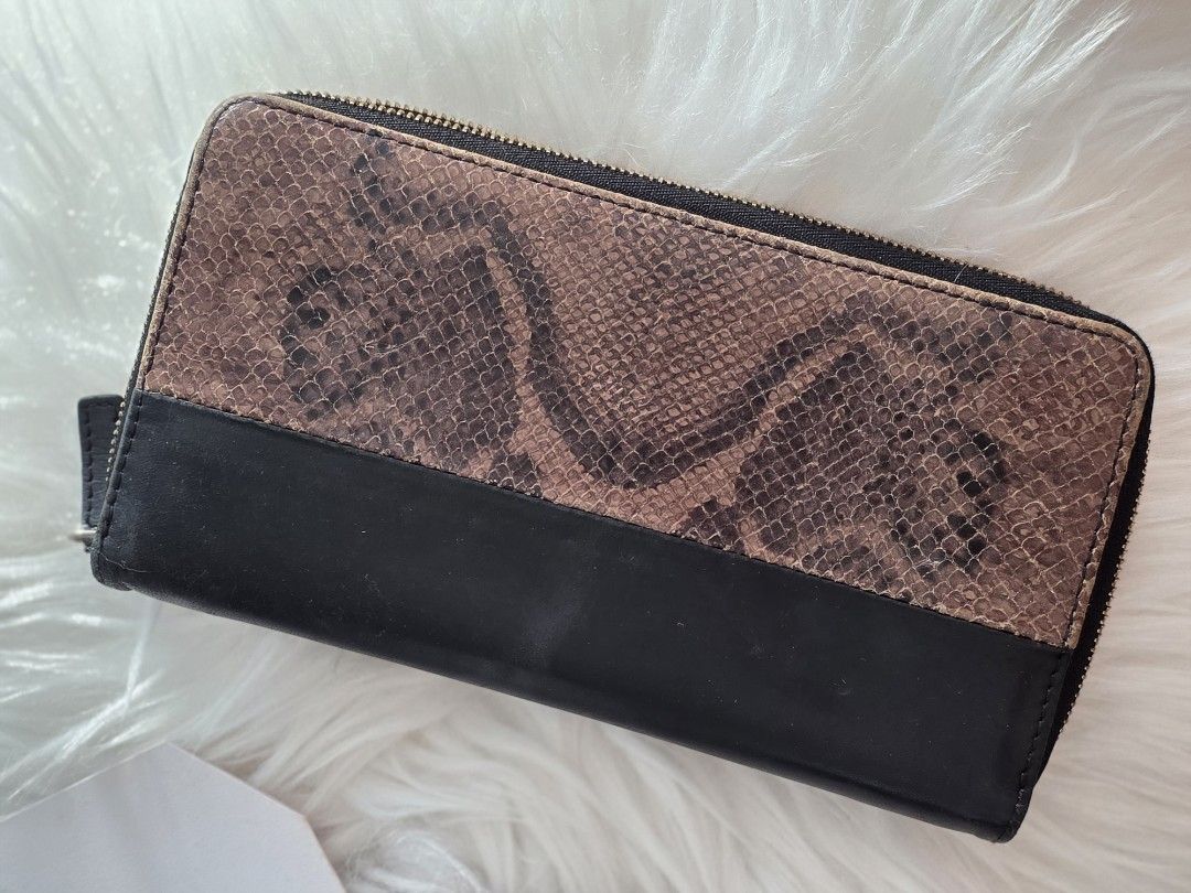 Celine Python Two Tone Wallet (Category: Bags & Wallets) located in Singapore. Submitted by lw.y.y (Listing ID 1452184444, Image 2). Description: Gorgeous Celine Python Pattern Long Wallet with a two-tone design featuring python skin and smooth black leather. lost dustbag, come with cards. Brand: Celine Material: Python skin and calfskin leather Design: Long wallet with a zipper closure and a python skin upper panel bought $1000+!.