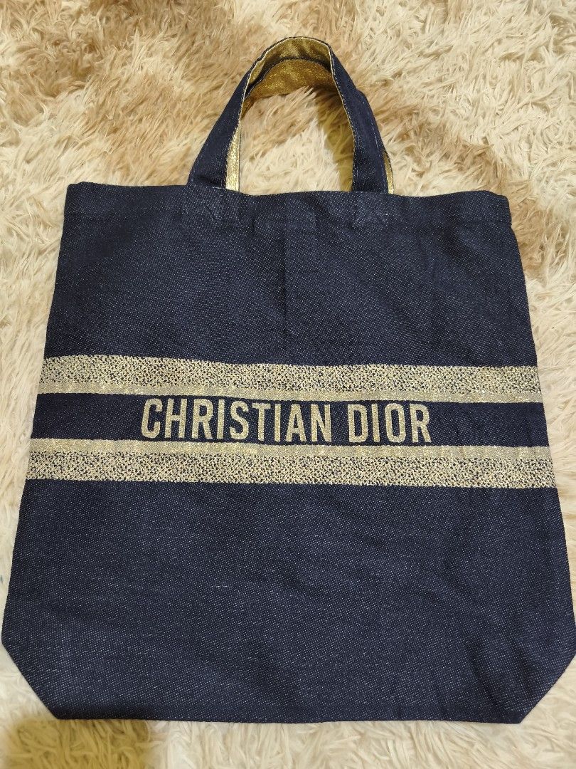 Christian Dior Denim Tote Bag (Category: Luxury Bags & Wallets) located in La Paz. Submitted by carou89146 (Listing ID 1452255603, Image 1). Description: -Not sure of it's authenticity, inner tag removed - Dark soft denim with elegant gold accents - Features iconic Dior logo on one side and intricate pattern on the other - Made in Italy - Ideal for stylish everyday carry 14.5 x 15 inches Bought in Japan Surplus GCash plus sf location Ilocos Provi