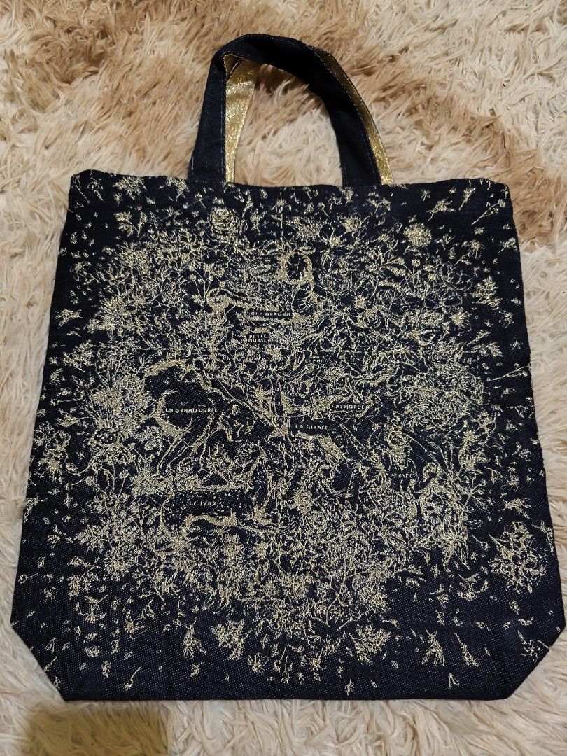 Christian Dior Denim Tote Bag (Category: Luxury Bags & Wallets) located in La Paz. Submitted by carou89146 (Listing ID 1452255603, Image 2). Description: -Not sure of it's authenticity, inner tag removed - Dark soft denim with elegant gold accents - Features iconic Dior logo on one side and intricate pattern on the other - Made in Italy - Ideal for stylish everyday carry 14.5 x 15 inches Bought in Japan Surplus GCash plus sf location Ilocos Provi