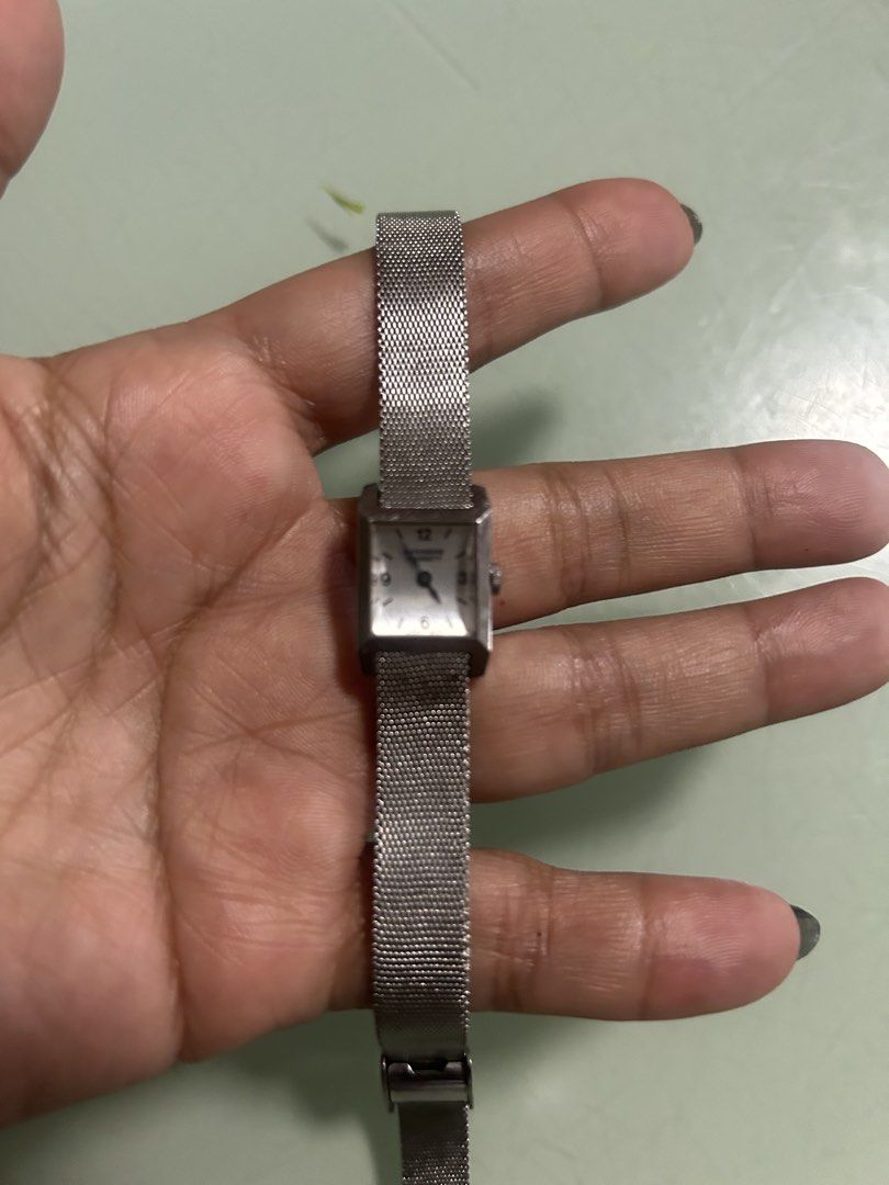 Citizen Stainless Steel Mesh Strap Watch (Category: Men's Watches) located in Cavite. Submitted by mamamia73 (Listing ID 1452206257, Image 1). Description: - Classic Citizen watch - Silver-tone stainless steel case - Matching adjustable mesh strap for a comfortable fit - Rectangular face with easy-to-read markers - Works well - Versatile for everyday wear or dressing up.