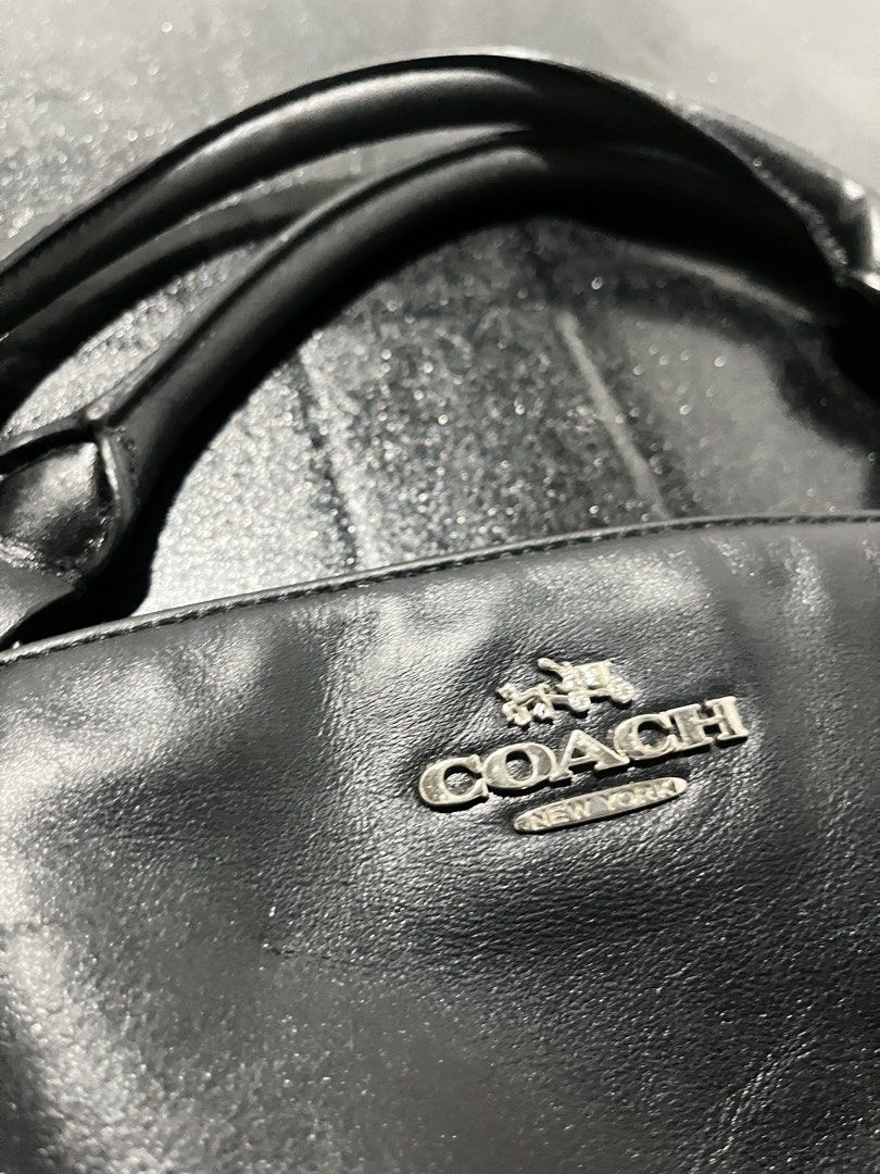 Coach Black Leather Shoulder Bag (Category: Shoulder Bags) located in Rizal. Submitted by oddflower_0b1b39 (Listing ID 1452208235, Image 2). Description: - Genuine black leather Coach handbag - Versatile with top handles and a detachable shoulder strap - Elegant silver hardware details - Spacious interior for all your essentials - Ideal for everyday wear and stylish outings.