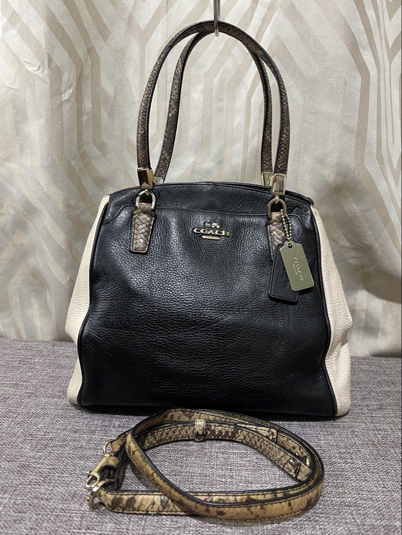 Coach Minetta Crossbody Satchel with Exotic Python/Snakeskin Trim (Category: Luxury Bags & Wallets) located in Davao. Submitted by hiedelle1120 (Listing ID 1452114472, Image 1). Description: Preloved item💚 ☘️Coach Exotic Trim Minetta Pebbled Leather Satchel Handbag Crossbody Purse ▪️Approx. 11” (W) x 9” (H) x 4” (D) ▪️Handles with 5” drop ▪️Detachable strap with 22” drop for shoulder or crossbody wear ▪️Exterior Material: Pebbled Leather ▪️Hardw