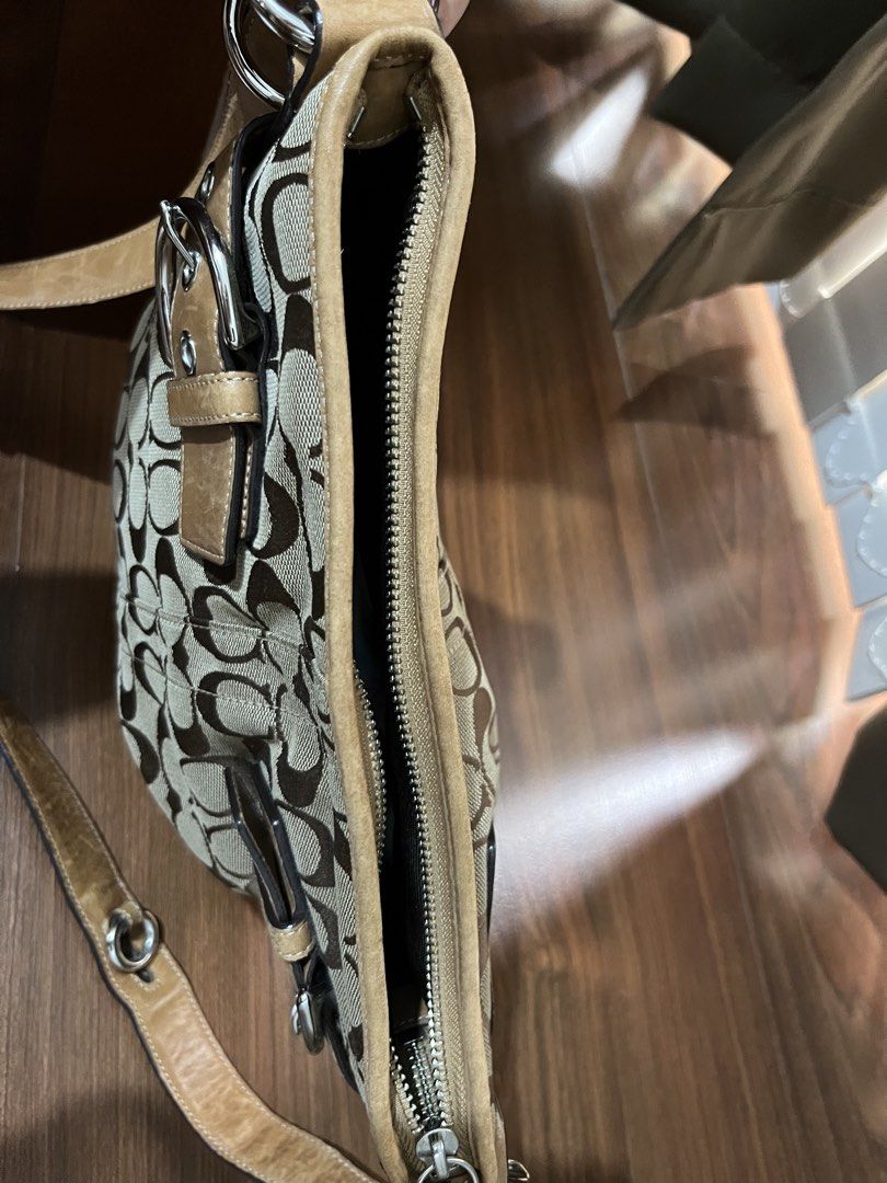 Coach Vintage Signature Shoulder/crossbody bag (Category: Luxury Bags & Wallets) located in Bacolor. Submitted by livephoenix (Listing ID 1452117431, Image 3). Description: - Authentic Classic Coach monogram canvas crossbody bag - Tan leather trim and strap - Silver hardware with buckle details - Secure zipper closure - Interior zippered pocket and slip pockets - Visible serial number inside - Ideal for everyday use - Bought from Japan.