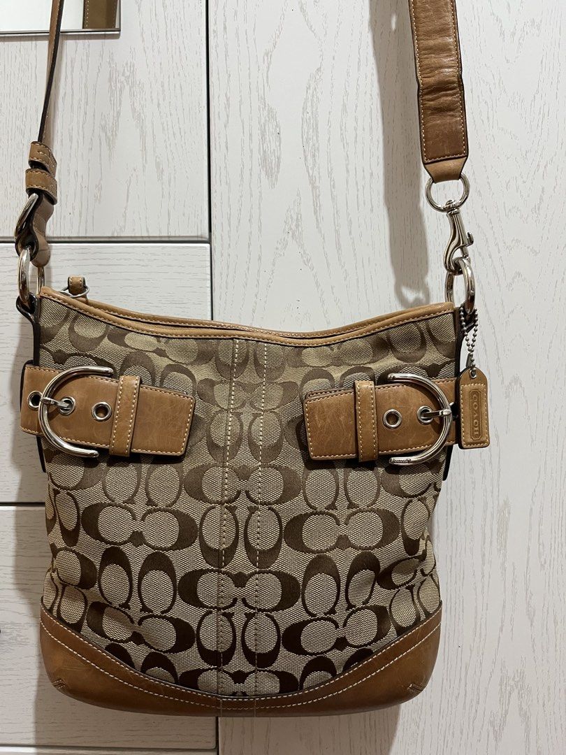 Coach Vintage Signature Shoulder/crossbody bag (Category: Luxury Bags & Wallets) located in Bacolor. Submitted by livephoenix (Listing ID 1452117431, Image 1). Description: - Authentic Classic Coach monogram canvas crossbody bag - Tan leather trim and strap - Silver hardware with buckle details - Secure zipper closure - Interior zippered pocket and slip pockets - Visible serial number inside - Ideal for everyday use - Bought from Japan.