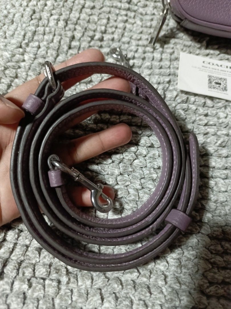 Coach Purple Leather sling with Strap and Dust Bag (Category: Luxury Bags & Wallets) located in Subic. Submitted by addiestrend (Listing ID 1452159656, Image 3). Description: - Adorable purple Coach pouch - Crafted from textured leather - Convenient top handle - Detachable crossbody strap for versatile wear - Interior card slots for organization - Comes with original dust bag - Includes authenticity card -flawless complete inclusion.