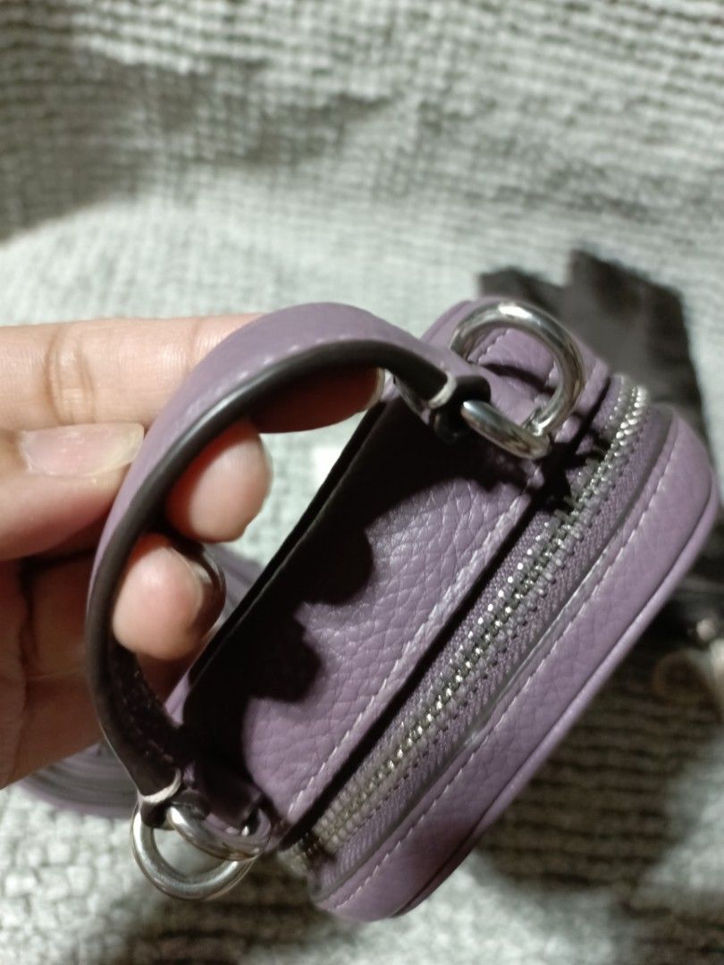 Coach Purple Leather sling with Strap and Dust Bag (Category: Luxury Bags & Wallets) located in Subic. Submitted by addiestrend (Listing ID 1452159656, Image 2). Description: - Adorable purple Coach pouch - Crafted from textured leather - Convenient top handle - Detachable crossbody strap for versatile wear - Interior card slots for organization - Comes with original dust bag - Includes authenticity card -flawless complete inclusion.