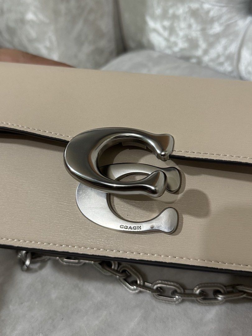 Coach Tabby Shoulder Bag 26 Beige (Category: Luxury Bags & Wallets) located in Davao. Submitted by ela00000 (Listing ID 1452299881, Image 2). Description: - Authentic Coach Tabby shoulder bag - Color: Beige - Straps: Chain strap and leather strap included - Hardware: Silver tone with iconic Coach C logo closure - Interior: Multiple compartments and a zip pocket - Price: P15,000 - Ideal for everyday wear - used only once pag punta ko ng Taiwan las