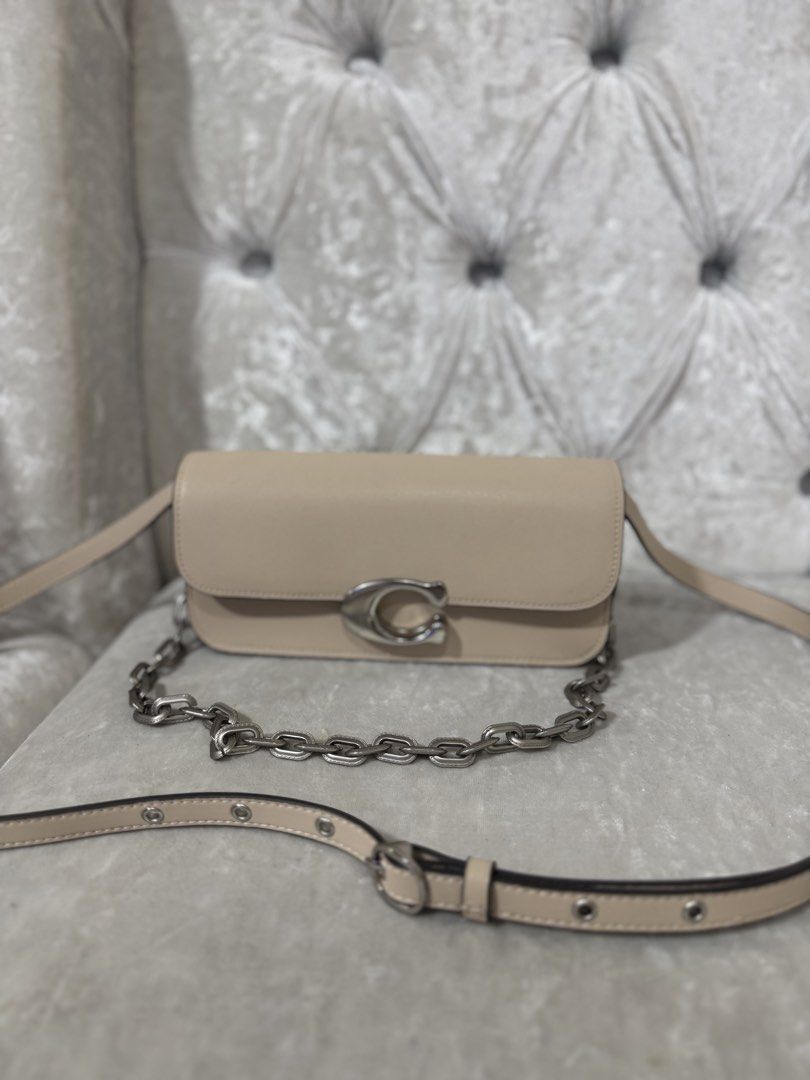 Coach Tabby Shoulder Bag 26 Beige (Category: Luxury Bags & Wallets) located in Davao. Submitted by ela00000 (Listing ID 1452299881, Image 1). Description: - Authentic Coach Tabby shoulder bag - Color: Beige - Straps: Chain strap and leather strap included - Hardware: Silver tone with iconic Coach C logo closure - Interior: Multiple compartments and a zip pocket - Price: P15,000 - Ideal for everyday wear - used only once pag punta ko ng Taiwan las