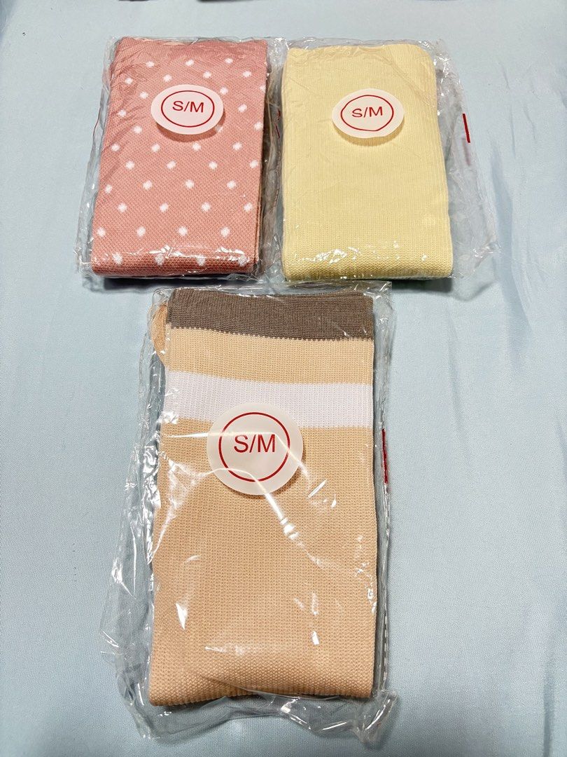 Compression Socks (Category: Socks & Tights) located in Singapore. Submitted by nheedzy (Listing ID 1452182713, Image 1). Description: Fit up to size 38 Available colors: pink, yellow, beige $5 each .