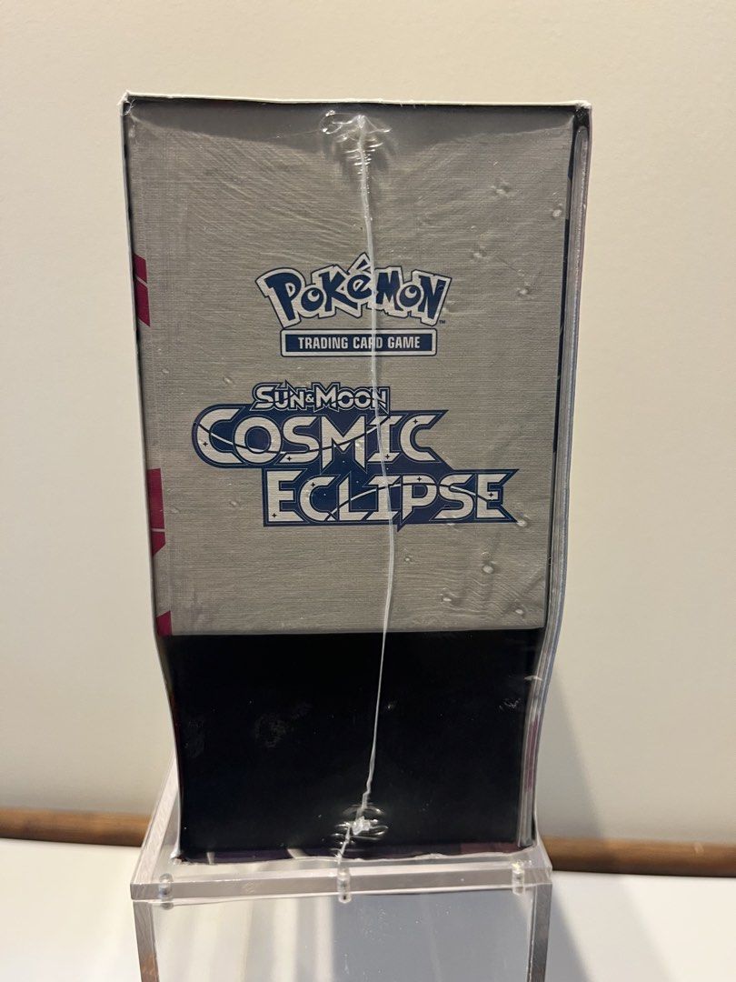 Cosmic Eclipse ETB (Category: Card Boxes & Cases) located in Singapore. Submitted by theyhaveacavetroll (Listing ID 1452245679, Image 3). Description: 2019 Sun & Moon Era • Tag Team Legacy • Iconic Character Rares Letting go of a sealed Cosmic Eclipse ETB, the final main set of the Sun & Moon era (2019). Cosmic Eclipse is widely celebrated for its Tag Team GX cards, Kanto‑rooted duos, and the introduction of Character Rares — a feature that shape