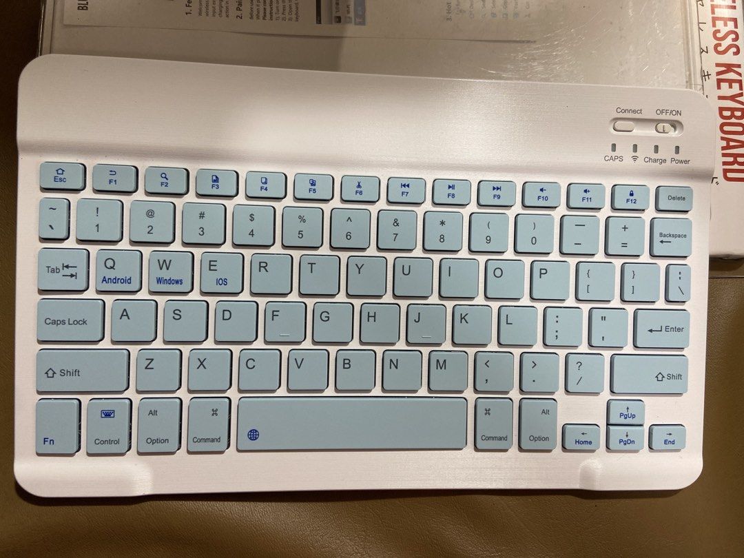 Daiso Wireless Bluetooth Keyboard with USB Charging Cable (Category: Computer Keyboard) located in Manila. Submitted by kimjongin (Listing ID 1452198599, Image 2). Description: - White and light blue wireless Bluetooth keyboard - Bluetooth 5.0 connectivity - Compatible with Windows, iOS, and Android devices - Built-in rechargeable battery - Includes USB charging cable - Ideal for travel and everyday use.
