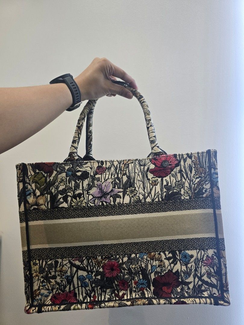 Dior Book Tote Medium Mille Fleurs Bag (Category: Luxury Bags & Wallets) located in Taguig. Submitted by mluxeph (Listing ID 1452133296, Image 2). Description: Dior Book Tote Medium Mille Fleurs Bag Gender: Ladies Material: Canvas Stamp: 50 MA 1210 Year: 2020 Interior: One Main Compartment Measurements: 14.25”L X 6.4”W X 10.9”H Handle Drop: 6.75" Hardware: None Inclusions: NONE Detailed Item Description: The item has been used but no major signs 